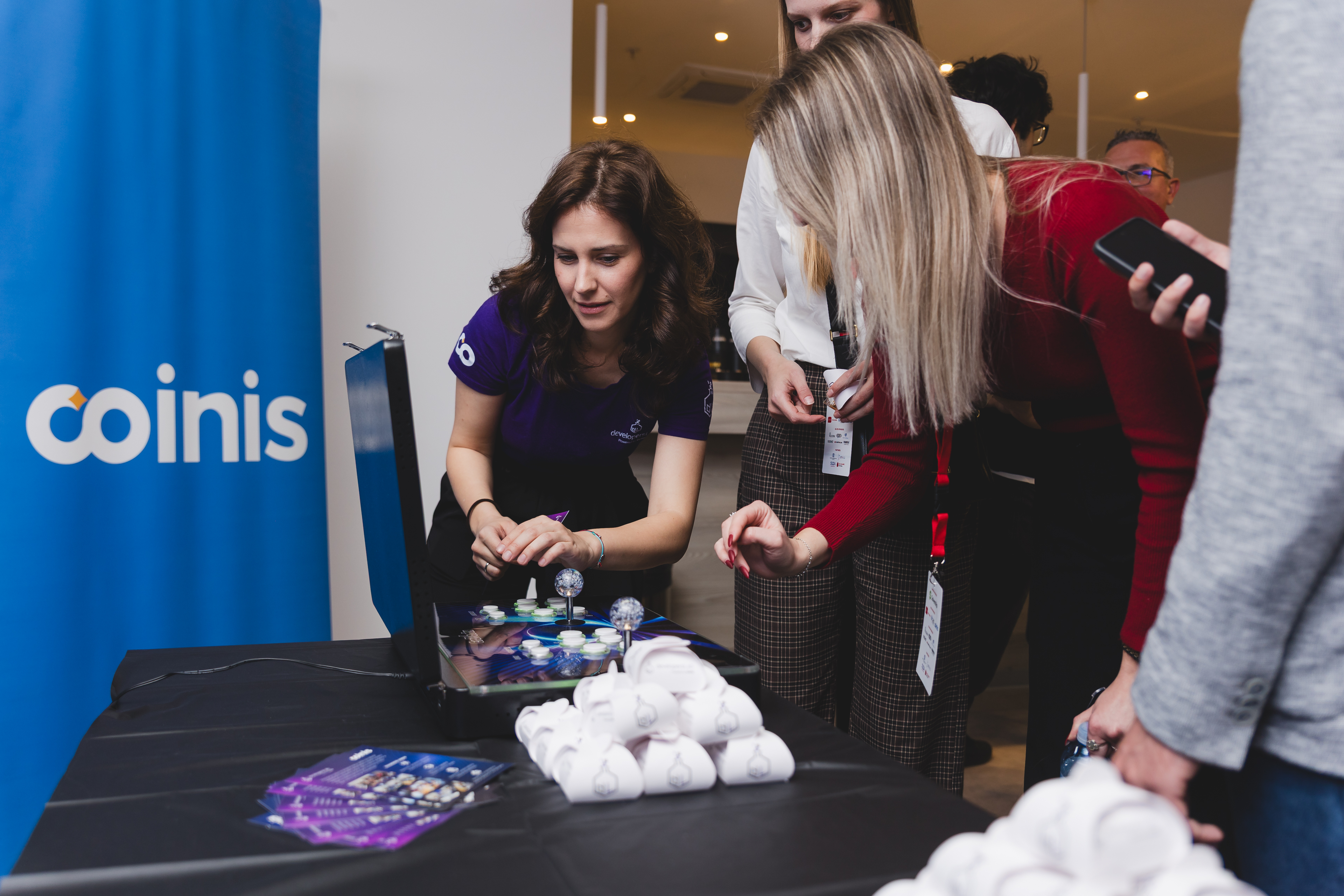 Coinis team at an industry conference booth